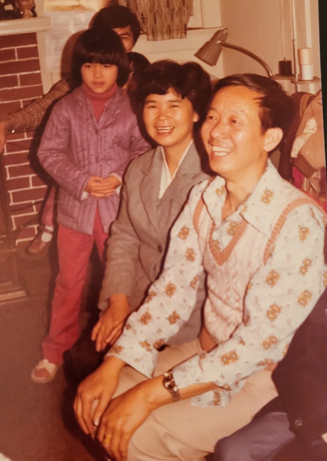 Mike Ye’s parents reunited with extended family on their first day in America, with Mike’s young cousin standing behind them